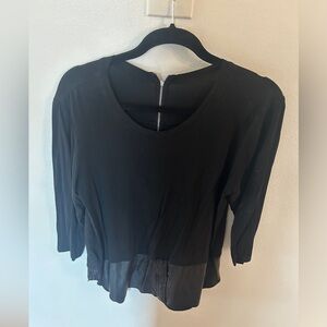 Two long sleeve shirts. One with denim bottom and one with faux leather bottom.